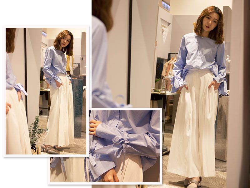 【LOOK 5】柔和派好感色系必備單品:造型襯衫+及地寬版褲在春夏最受歡迎的水藍、白、粉等清新明亮的色系,是提升好感度的最佳選擇!如何為平凡造型中加入鮮明的個人印象,可選擇在上衣下襬或袖口處有獨特設計的款式,像是1/2 UN-DEMI運用繫繩綁帶束口的寬袖襯衫,搭配上SKETCHAROUND顯瘦的寬版裙褲,讓低調優雅的魅力在不誇張的設計巧思中一一展現。