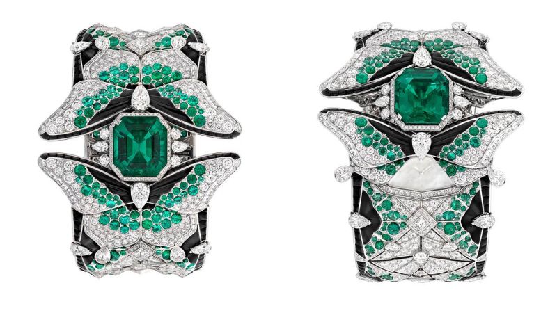 PAPILLON SECRET 腕錶白K金、鑽石、祖母綠、黑色尖晶石、縞瑪瑙、白色珍珠貝母、一顆14.57克拉祖母綠切割祖母綠(哥倫比亞)、手動上鏈機械機芯。以指尖移動蝴蝶的後翅,即顯露隱藏其後的珍珠貝母錶盤。讓佩戴者在祖母綠、黑色尖晶石及鑽石的簇擁下窺視時間。